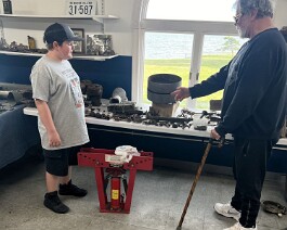 Dick Shappy showing grandson Ryker a few of the Reading Standard parts that were brought back from Oley, Pennsylvania.